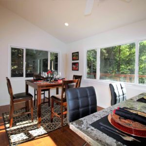 Staged Dining Area with Red Orchids