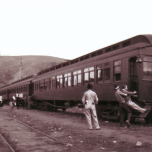 Cowboy Lifting Another Man into a Train Near Jenner CA, Circa 1935