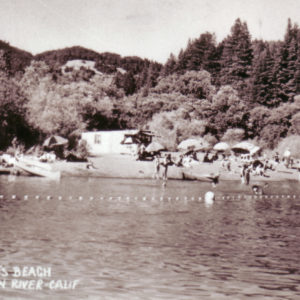 Umbrellas, Swimmers and Sunbathers at Roland's Beach in Rio Nido CA