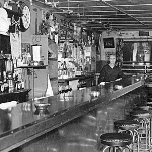 Bartender Standing Behind the Bar at the Sky Room Bar in Cazadero California