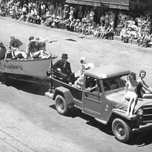 Willy's Truck Pulling the Monte Rio Auxiliary Boat Float Filled with Women Wearing Bathing Suits at Stump Town Parade in 1966